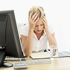 migraines women holding her head