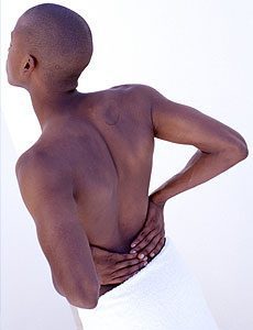 pelvis hip pain Man holding his hips