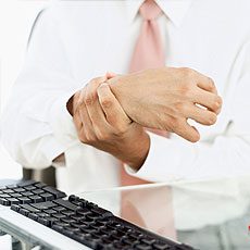 Man holdiing his wrist
